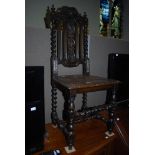 LATE 19TH / EARLY 20TH CENTURY CARVED OAK HALL CHAIR WITH CARVED PANEL SEAT SUPPORTED ON BARLEY