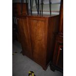 A 19TH CENTURY MAHOGANY LINEN PRESS WITH TWO FIELDED PANELLED DOORS, ON BRACKET FEET