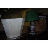 AN ORIENTAL PATTERNED TABLE LAMP AND SHADE, TOGETHER WITH A WICKER LAUNDRY BASKET AND WHITE LINED