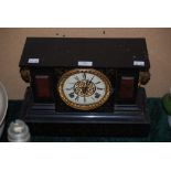 VICTORIAN BLACK SLATE MANTEL CLOCK WITH ENAMELLED DIAL AND ROMAN NUMERALS