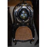 19TH CENTURY BLACK LACQUERED PAPIER MACHE HALL CHAIR WITH CANE WORK SEAT DECORATED WITH MOTHER OF