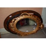 MODERN GILT FRAMED OVAL SHAPED WALL MIRROR TOGETHER WITH TWO MAHOGANY FRAMED OVAL BEVELLED WALL