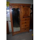 OAK ARTS & CRAFTS COMPACT WARDROBE WITH FOUR DRAWERS AND PANELLED DOOR WITH COPPER HINGES TO ONE