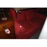 RED UPHOLSTERED TWO SEAT SOFA