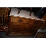 STAINED OAK SIDE CABINET WITH TWO FRIEZE DRAWERS AND TWO PANELLED DOORS WITH MARBLE TOP