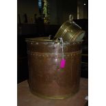 A COPPER AND BRASS FUEL BIN TOGETHER WITH BRASS PLANTER