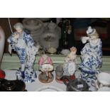 TWO PAIRS OF CONTINENTAL PORCELAIN FIGURINES