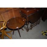 AN OAK DROP LEAF OCCASIONAL TABLE TOGETHER WITH A MAHOGANY CIRCULAR OCCASIONAL TABLE WITH ADJUSTABLE