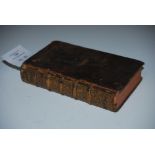 AN 18TH CENTURY LEATHER BOUND BOOK - TRAITE DU VRAI MERITE DE L'HOMME, AMSTERDAM 1738
