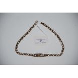 A 9CT GOLD NECKLACE, 16.9 GRAMS