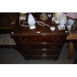 REPRODUCTION MAHOGANY FOUR DRAWER CHEST ON BRACKET FEET