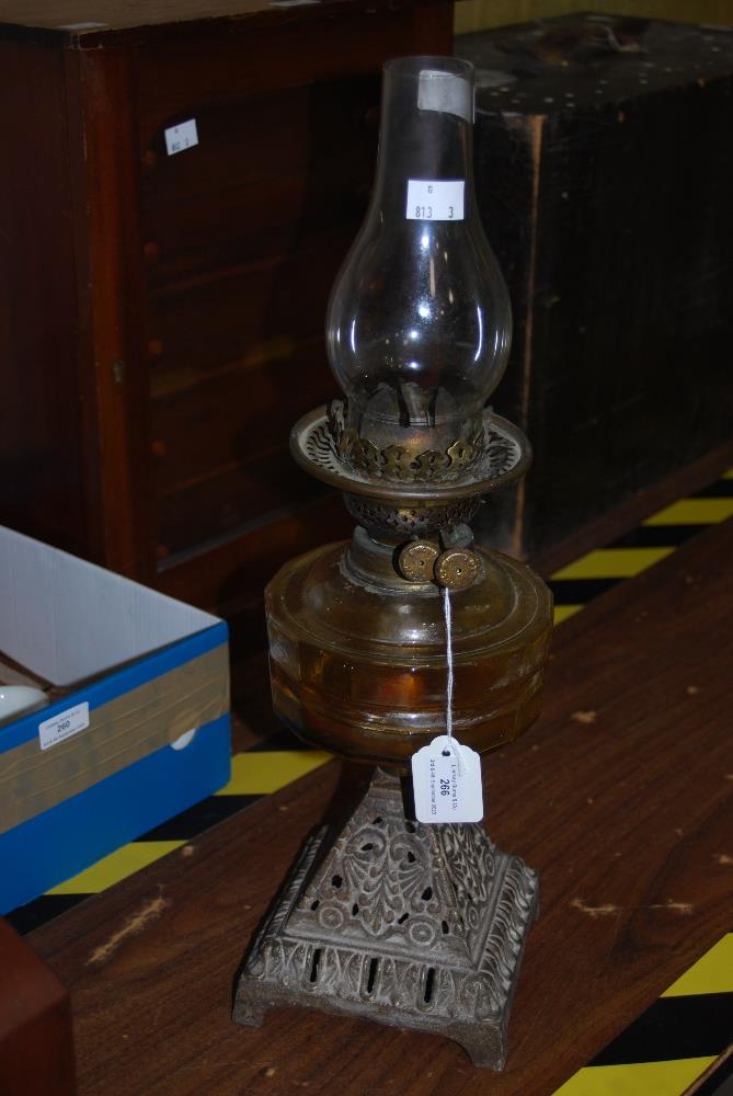 VICTORIAN OIL LAMP WITH CAST IRON BASE, CLEAR GLASS FONT AND CLEAR GLASS FUNNEL