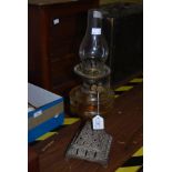 VICTORIAN OIL LAMP WITH CAST IRON BASE, CLEAR GLASS FONT AND CLEAR GLASS FUNNEL