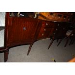 REPRODUCTION MAHOGANY DINING ROOM SUITE COMPRISING OF SERPENTINE FRONTED SIDEBOARD, EXTENDING DINING