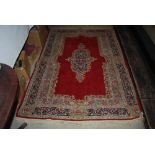 MACHINE WOVEN EASTERN PATTERNED RUG WITH GEOMETRIC DESIGN BORDER AND CENTRAL PANEL WITH SINGLE