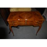 REPRODUCTION WALNUT FRENCH STYLE DRESSING TABLE WITH THREE FRIEZE DRAWERS AND BRUSH SLIDE, ON