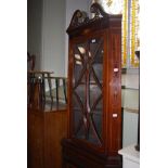 A 19TH CENTURY MAHOGANY INLAID TWO PART CORNER CABINET WITH SWAN NECK PEDIMENT, THE UPPER SECTION