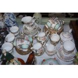 THREE PART TEA SETS INCLUDING A GROSVENOR BLUE, WHITE, FLORAL AND GILT TEA SERVICE, AN