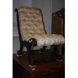 A 19TH CENTURY STAINED MAHOGANY BUTTON BACK NURSERY CHAIR WITH TURNED STRETCHERS
