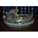 ****WITHDRAWN LOT**** DECORATIVE PORCELAIN TUREEN IN THE FORM OF A DUCK WITH OCHRE, GREEN AND