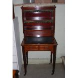 VICTORIAN MAHOGANY AND GILT METAL MOUNTED WRITING TABLE, THE UPRIGHT BACK WITH RECTANGULAR TOP AND