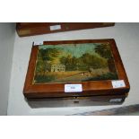 A 19TH CENTURY WALNUT BOX WITH PAINTED PICTORIAL PANEL OF FIGURES AND COUNTRY HOUSE, CONTAINING