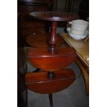 19TH CENTURY MAHOGANY THREE TIER DROP LEAF WHATNOT SUPPORTED ON THREE SPLAYED LEGS