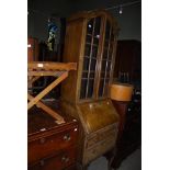 20TH CENTURY WALNUT BUREAU BOOKCASE WITH GLAZED ASTRAGAL DOORS SUPPORTED ON CABRIOLE LEGS