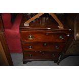 A 19TH CENTURY MAHOGANY THREE DRAWER CHEST OF DRAWERS SUPPORTED ON BRACKET FEET