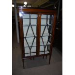 EDWARDIAN MAHOGANY INLAID TWO DOOR CHINA CABINET WITH GLAZED ASTRAGAL DOORS SUPPORTED ON SQUARE