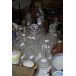 ASSORTED GLASSWARE INCLUDING GLASS EWERS AND STOPPERS, DECANTERS AND STOPPERS, GLASS FINGER BOWL,