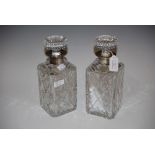 PAIR OF BIRMINGHAM SILVER MOUNTED CUT GLASS DECANTERS AND STOPPERS