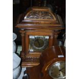 A 19TH CENTURY CARVED WALNUT CASED BRACKET CLOCK WITH CHASED BRASS AND SILVERED DIAL