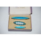 BOX CONTAINING THREE VINTAGE BLUE ENAMELLED BAR BROOCHES
