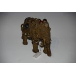 EASTERN GILT METAL FILIGREE AND HARDSTONE CABOCHON SET MODEL OF AN ELEPHANT