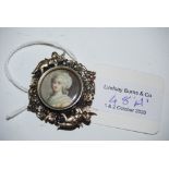 AN 18TH CENTURY WHITE METAL MOUNTED PORTRAIT MINIATURE OF A LADY, MOUNTED AS A BROOCH, THE