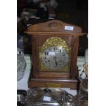 EARLY 20TH CENTURY OAK CASED MANTEL CLOCK WITH PRESENTATION PLAQUE 'PRESENTED TO J. BROUGH BY