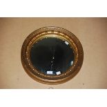 A GILT FRAMED REGENCY STYLE CIRCULAR CONVEX WALL MIRROR