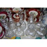 EIGHT ASSORTED CUT GLASS DECANTERS AND STOPPERS
