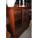 EDWARDIAN MAHOGANY INLAID TWO DOOR GLAZED BOOKCASE WITH SINGLE FRIEZE DRAWER