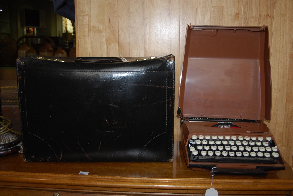 LEATHER FILE CASE AND A SMITHS CORONA TYPEWRITER IN CASE