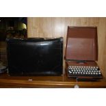 LEATHER FILE CASE AND A SMITHS CORONA TYPEWRITER IN CASE