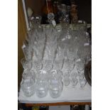 LARGE QUANTITY OF ASSORTED CUT GLASSWARE AND CRYSTAL INCLUDING DECANTERS AND STOPPERS, WHISKY