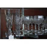 LARGE COLLECTION OF ASSORTED CUT GLASSWARE INCLUDING CHAMPAGNE FLUTES, WINE GOBLETS, ETC.