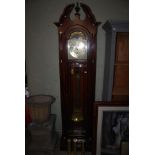 REPRODUCTION MAHOGANY LONGCASE CLOCK WITH BRASS DIAL AND THREE BRASS WEIGHTS AND PENDULUM