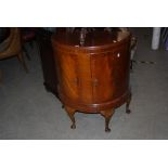 REPRODUCTION MAHOGANY BOW FRONT TWO DOOR CABINET ON CABRIOLE LEGS