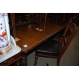 VICTORIAN MAHOGANY EXTENDING DINING TABLE SUPPORTED ON TURNED REEDED LEGS TOGETHER WITH FOUR