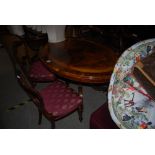 VICTORIAN ROSEWOOD OVAL SHAPED LOO TABLE TOGETHER WITH SET OF FOUR VICTORIAN ROSEWOOD VASE BACK