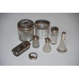 FIVE ASSORTED SILVER MOUNTED DRESSING TABLE BOTTLES, SILVER MOUNTED CUT GLASS PEPPER POT AND