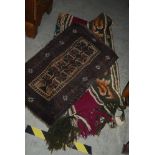 EASTERN BROWN GROUND PRAYER MAT, TOGETHER WITH A PUCE AND FLORAL PATTERNED THROW